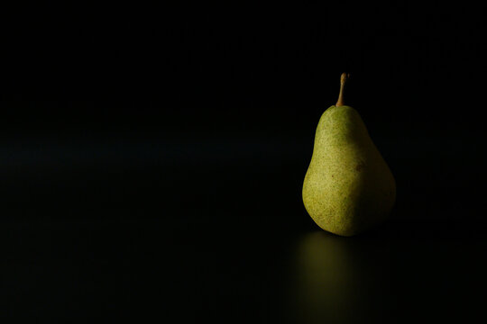 fresh fruit pear on black background