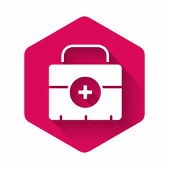 White First aid kit icon isolated with long shadow background. Medical box with cross. Medical equipment for emergency. Healthcare concept. Pink hexagon button. Vector