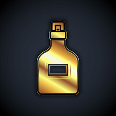Gold Alcohol drink Rum bottle icon isolated on black background. Vector