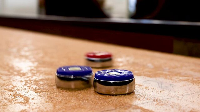 Closeup of Playing Shuffleboard