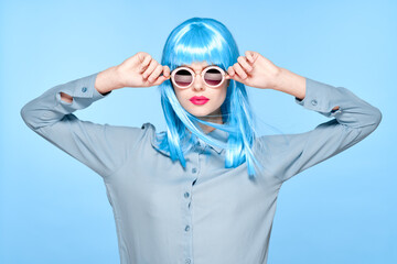 cheerful woman wearing sunglasses blue wig glamor model