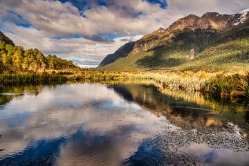 Mirror Lakes are a set of lakes lying north of Lake Te Anau and on the road from Te Anau to Milford Sound in New Zealand where the most amazing reflections are captured on the calm water