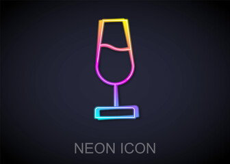 Glowing neon line Wine glass icon isolated on black background. Wineglass sign. Vector