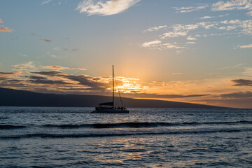 Beautiful Maui sunset with sun setting behind Lanai, Hawaii