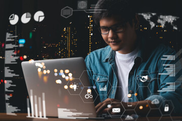 businessman financial analyst using laptop working at the office at night, graph interface, virtual screen, connection icons, digital diagram concept.