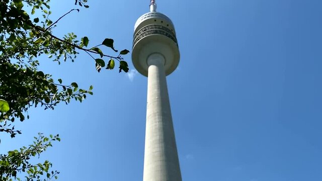 Munich, Germany. The Olympiaturm has an overall height of 291 m and a weight of 52,500 tonnes. At a height of 190 m there is an observation platform . HD