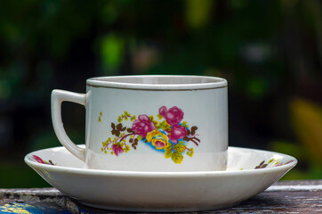 A vintage porcelain tea cup with flower motif
