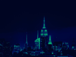 Fototapeta na wymiar Lights of the New York City skyline buildings at night with vibrant green and blue colors