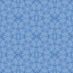Openwork pattern consisting of snowflakes. Winter pattern. Blue shades.