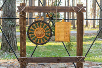 An ancient wooden Slavic calendar in the forest.