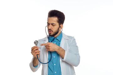 male doctor otoscope hospital treatment therapist light background