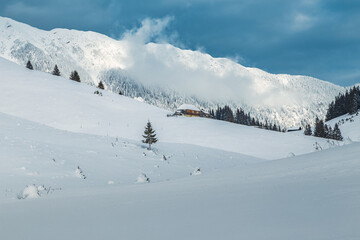 Fototapeta na wymiar Winter landscape with high snowy mountain ridge, Carpathians, Romania