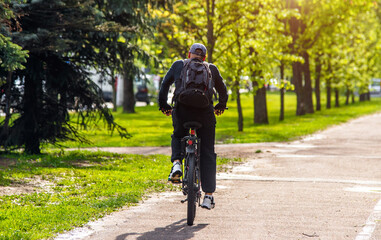 Cyclist ride on the bike path in the city Park
