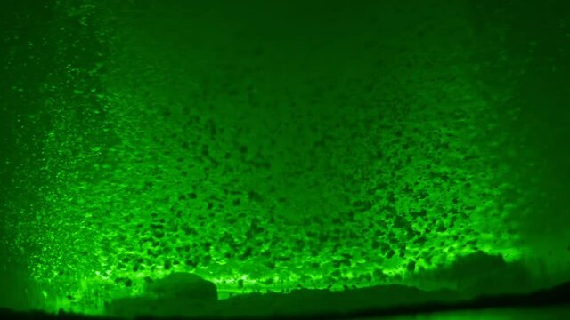 Paint fall into water which is twist. Spin acrylic ink drip into liquid. Visual effect bullet time, frozen moment, flow motion. Cloud fraction of color is spray drop. Slow motion cosmic video magic.
