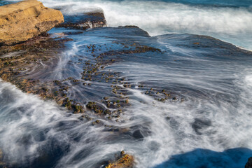 Waves Flowing Over Rock Shelf