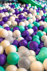 many small multi-colored plastic balls in the pool desk