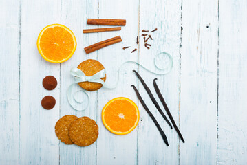 gingerbread cookies, slices of oranges, truffles and dessert spices