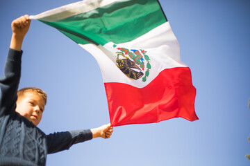 People holding flag of Mexico. 