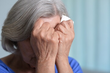Fototapeta premium Close up portrait of sick senior woman