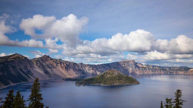 Time lapse of puffy clouds moving across the sky above Crater Lake in Oregon