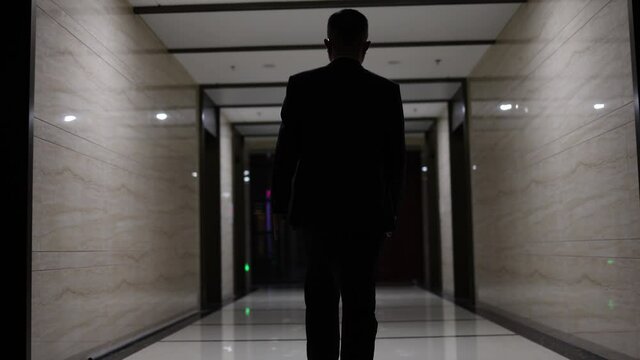 Figure of successful people walking forward in the company corridor.