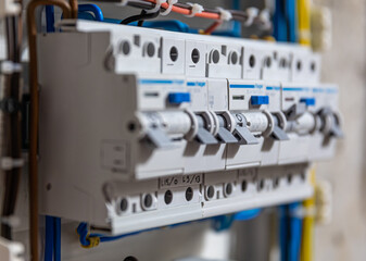 Switchboard with many switches and fiber optic cables.