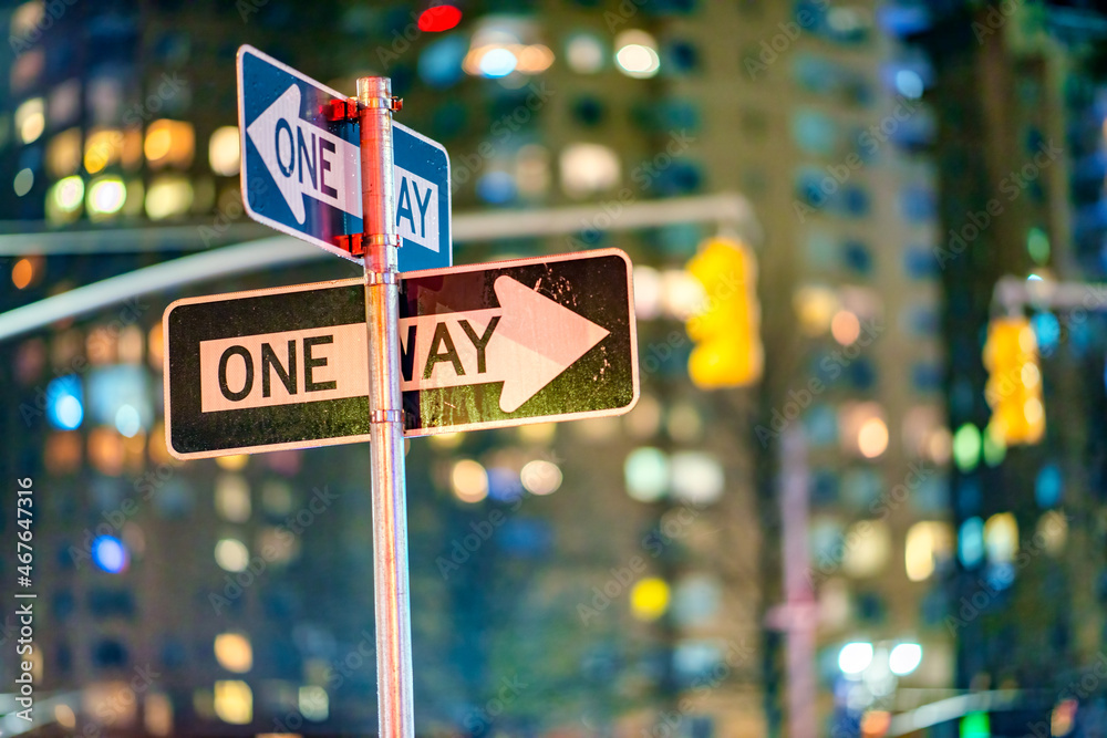 Sticker One way signs at night in New York City - Manhattan.