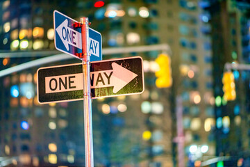 One way signs at night in New York City - Manhattan.