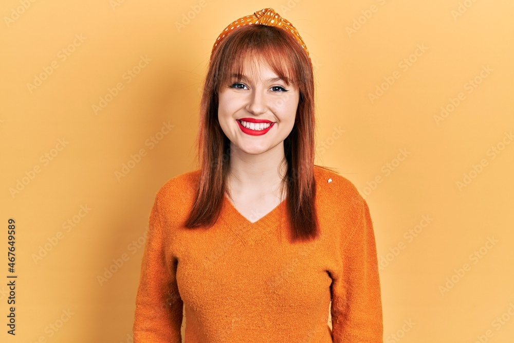 Canvas Prints Redhead young woman wearing casual orange sweater with a happy and cool smile on face. lucky person.