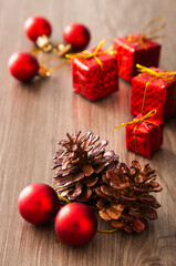 Christmas composition. Christmas gifts, decorations on wooden background.