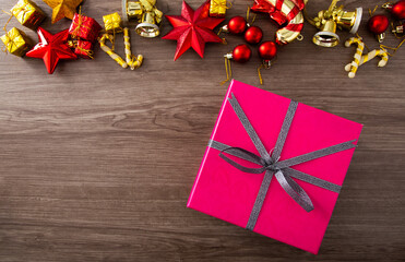 Christmas composition. Christmas gifts, decorations on wooden background. Flat lay