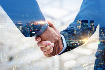 Partnership. multi exposure of investor businessman handshake with partner for successful meeting...