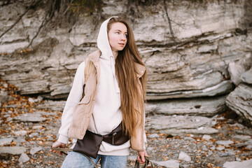 young woman walking outdoors at fall season