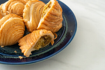 curry puff stuffed chicken on plate