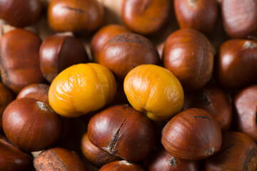Close-up Chestnuts with peeled  isolated on white background.