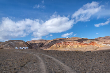 mountains colored glamping tent sky clouds autumn