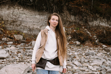 young woman walking outdoors at fall season