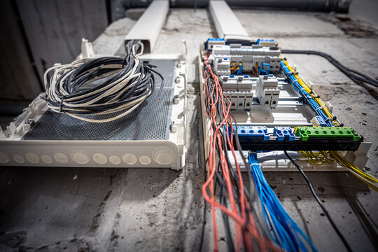 Switchboard With Many Switches And Fiber Optic Cables.