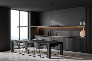 Corner view of minimalist dark grey kitchen with accent illumination