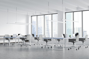 WHite and grey open space office with linear lights. Corner view.