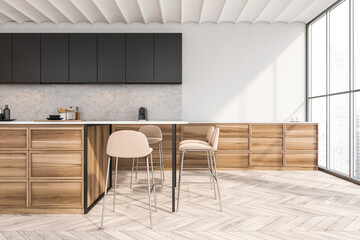 White kitchen interior with table and chairs on parquet floor