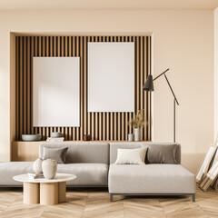 Light living room interior with sofa and coffee table, mockup posters
