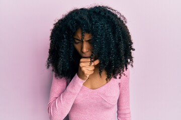 African american woman with afro hair wearing casual pink shirt feeling unwell and coughing as symptom for cold or bronchitis. health care concept.