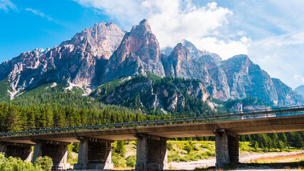 Dolomites mountains with forest and lake