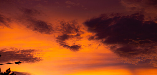 Fototapeta premium orange sky, evening, dusk, dark clouds, background image