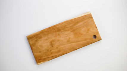 Olive wood cutting board on a white background