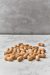 Image of bunch of peanuts on a marble table