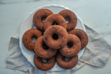 Chocolate glazed donut with chocolate chips 