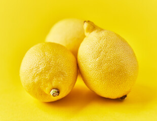  Bunch of lemons on a yellow background