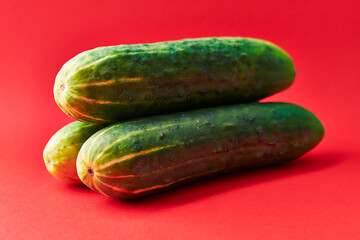  Bunch of cucumbers on a red background
